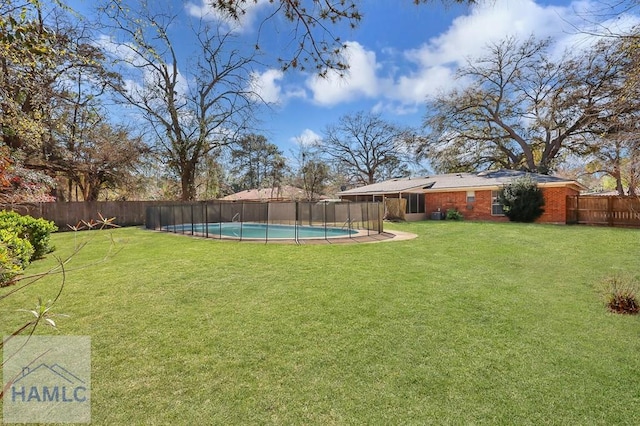 view of yard with a fenced in pool and a fenced backyard