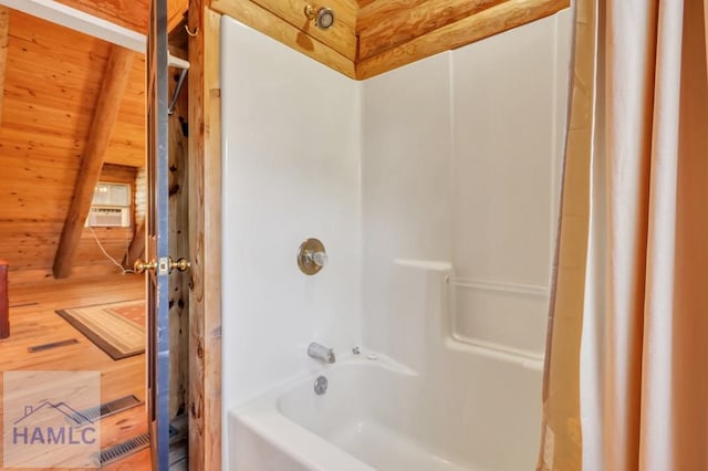 bathroom featuring wooden ceiling, wood-type flooring, and shower / bathtub combination