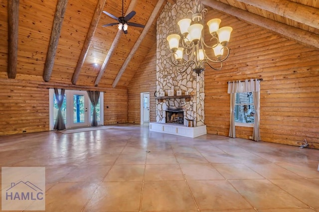 unfurnished living room with beam ceiling, high vaulted ceiling, a stone fireplace, and wood ceiling