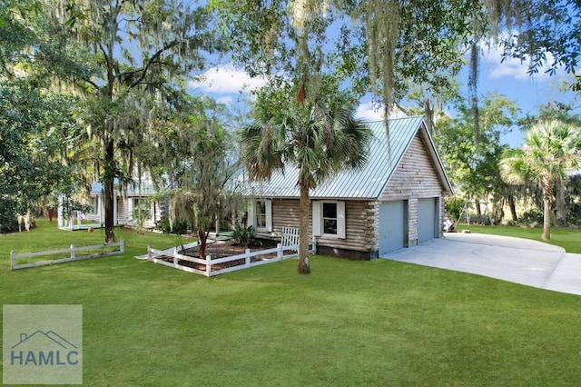 view of front of home featuring a front yard and a garage