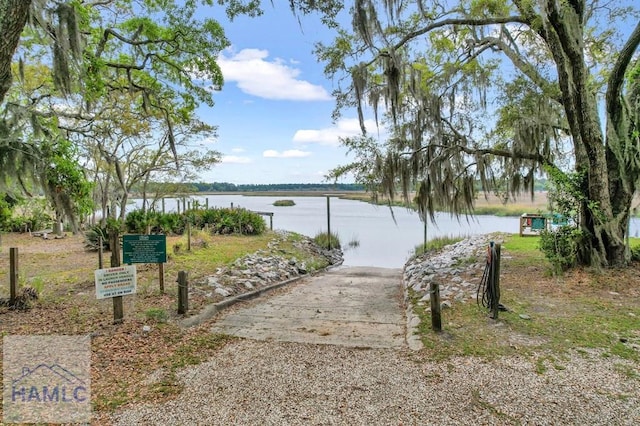 view of community with a water view