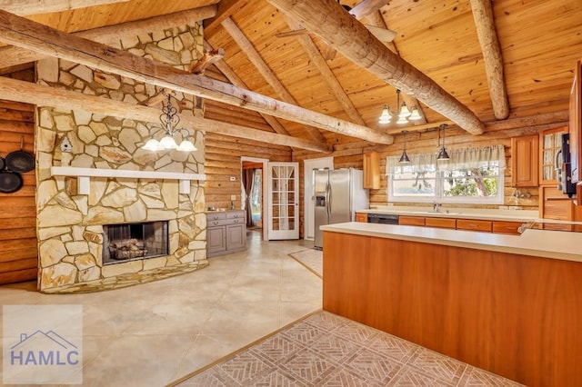 kitchen with stainless steel fridge with ice dispenser, rustic walls, wooden ceiling, and pendant lighting