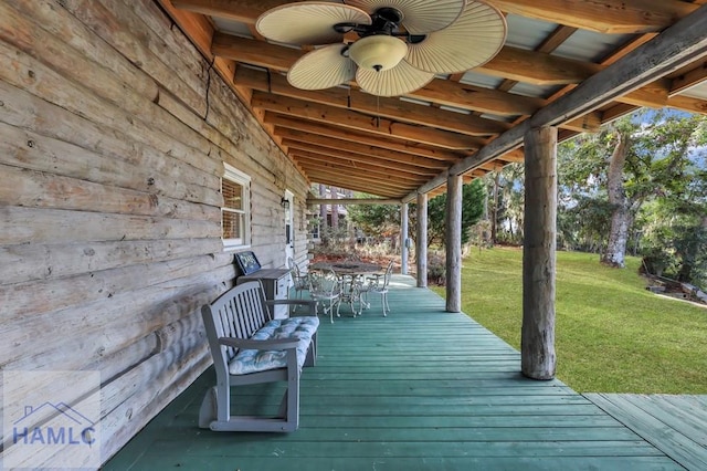 wooden terrace with a yard and ceiling fan