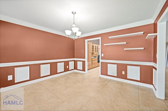 3638 Tibet Rd, Ludowici, GA 31316 - unfurnished room with a chandelier, crown molding, a decorative wall, wainscoting, and a textured ceiling
