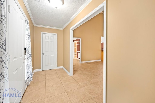 3638 Tibet Rd, Ludowici, GA 31316 - foyer featuring a textured ceiling, light tile patterned floors, and crown molding