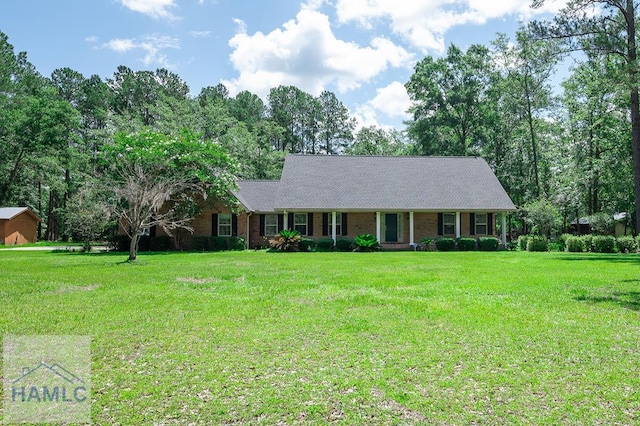 3638 Tibet Rd, Ludowici, GA 31316 - single story home with a front lawn and brick siding