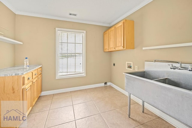 3638 Tibet Rd, Ludowici, GA 31316 - washroom featuring hookup for a washing machine, electric dryer hookup, cabinet space, crown molding, and light tile patterned floors