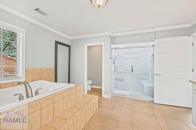 3638 Tibet Rd, Ludowici, GA 31316 - full bathroom featuring a bath, a shower stall, crown molding, and tile patterned flooring
