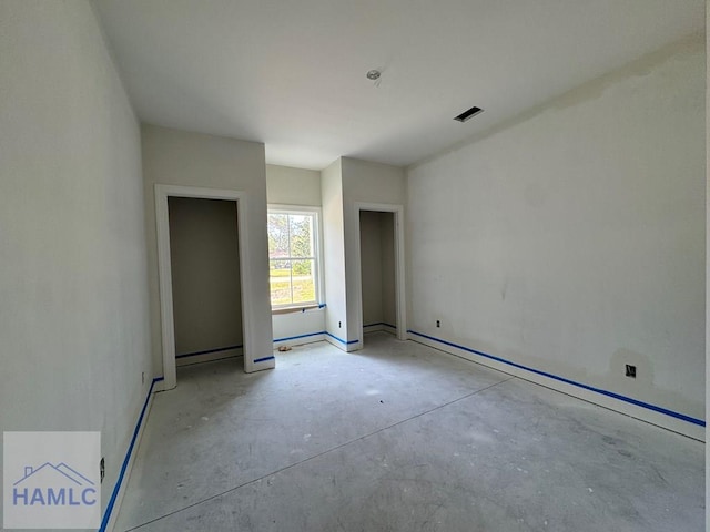 47 Ennis Rd, Pembroke, GA 31321 - unfurnished bedroom featuring concrete flooring and a baseboard radiator