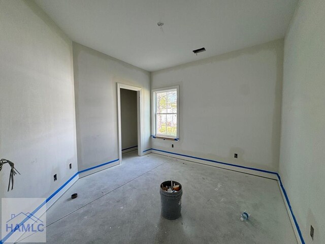 47 Ennis Rd, Pembroke, GA 31321 - unfurnished bedroom with concrete floors and baseboards
