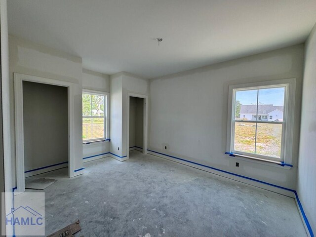 47 Ennis Rd, Pembroke, GA 31321 - unfurnished bedroom featuring unfinished concrete floors and baseboard heating