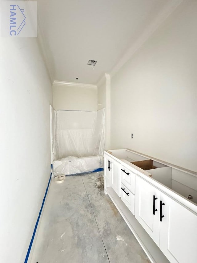 47 Ennis Rd, Pembroke, GA 31321 - corridor featuring unfinished concrete floors and crown molding