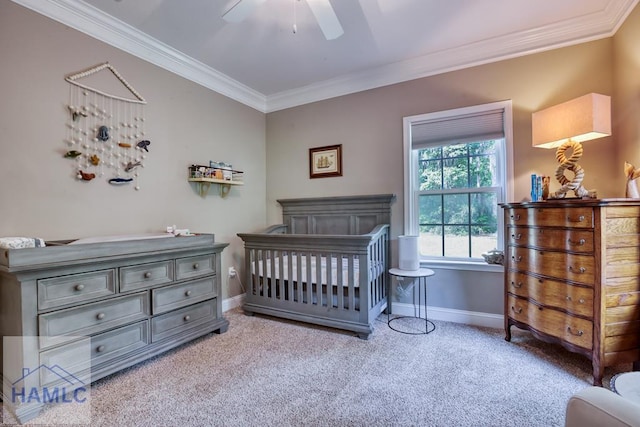 bedroom with carpet, crown molding, baseboards, and a ceiling fan