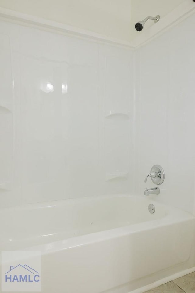 bathroom featuring tile patterned floors and tub / shower combination