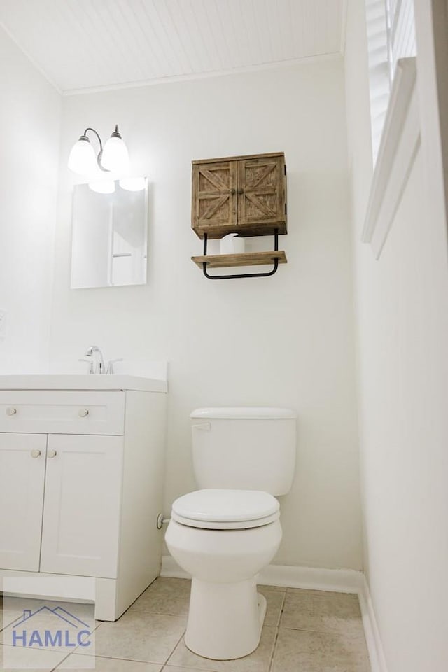 bathroom with tile patterned floors, vanity, and toilet