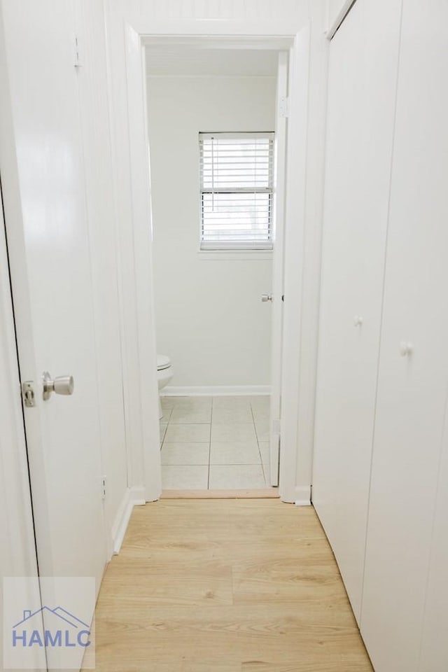 hall with light hardwood / wood-style flooring