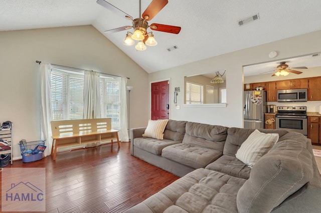 living room featuring ceiling fan, lofted ceiling, and dark hardwood / wood-style flooring