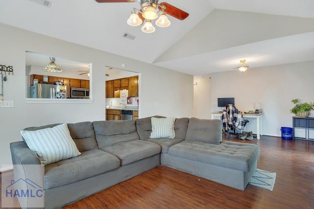 living room with lofted ceiling, dark wood-type flooring, and ceiling fan