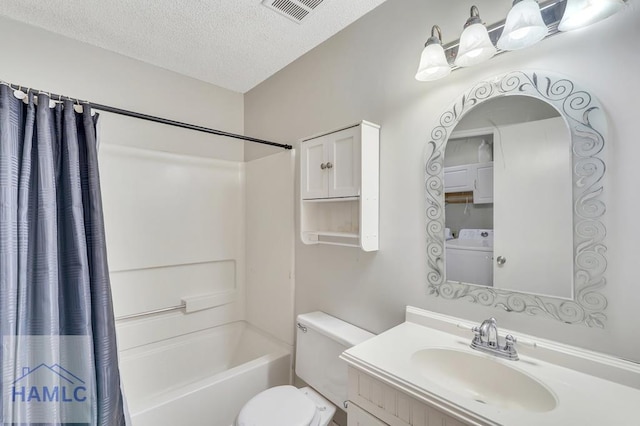 full bathroom featuring shower / tub combo with curtain, toilet, a textured ceiling, vanity, and washer / clothes dryer