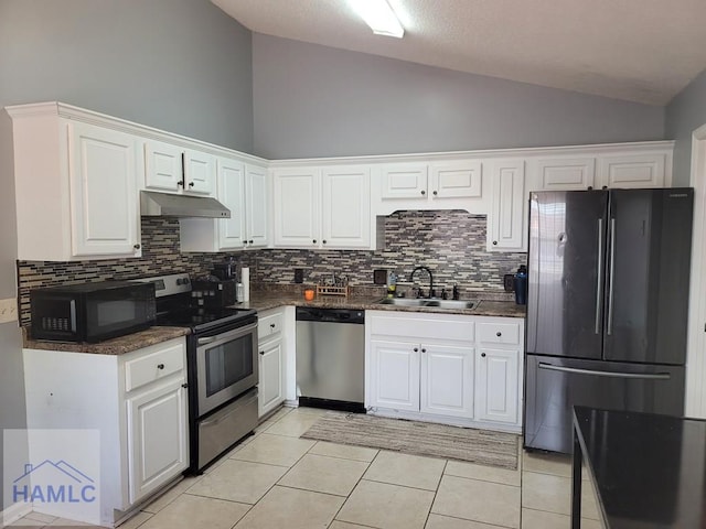 1441 Coalition Cir, Hinesville, GA 31313 - kitchen featuring black appliances, backsplash, white cabinetry, under cabinet range hood, and high vaulted ceiling