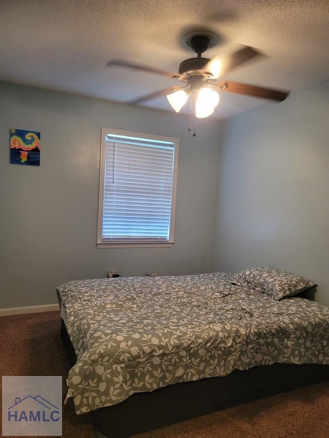 1441 Coalition Cir, Hinesville, GA 31313 - carpeted bedroom featuring a textured ceiling and a ceiling fan