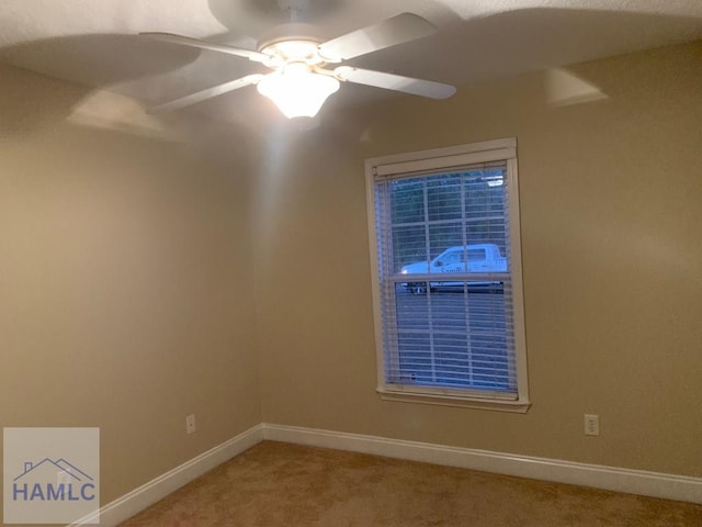 unfurnished room featuring carpet flooring and ceiling fan