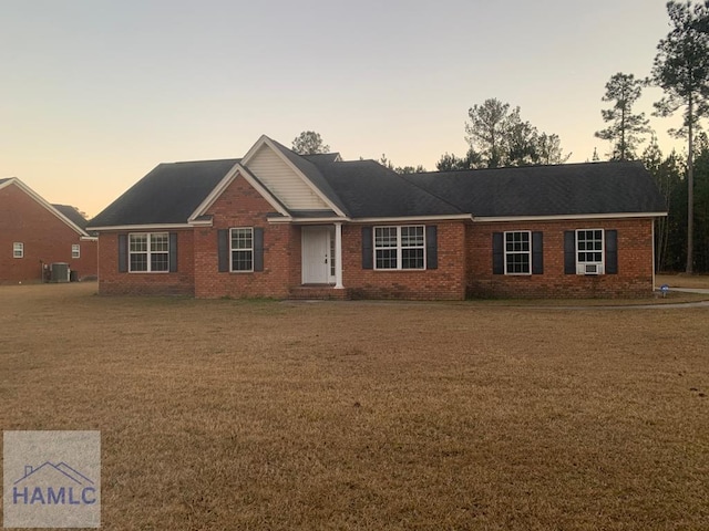 single story home featuring central air condition unit