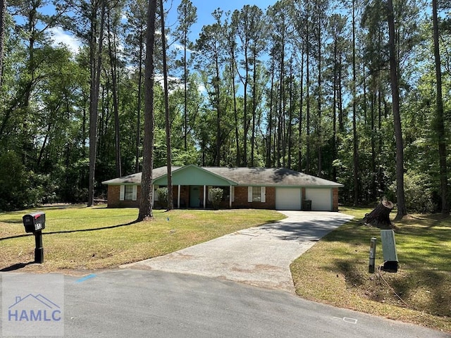 single story home with brick siding, concrete driveway, an attached garage, and a front lawn