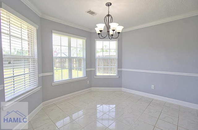 unfurnished room featuring an inviting chandelier and crown molding