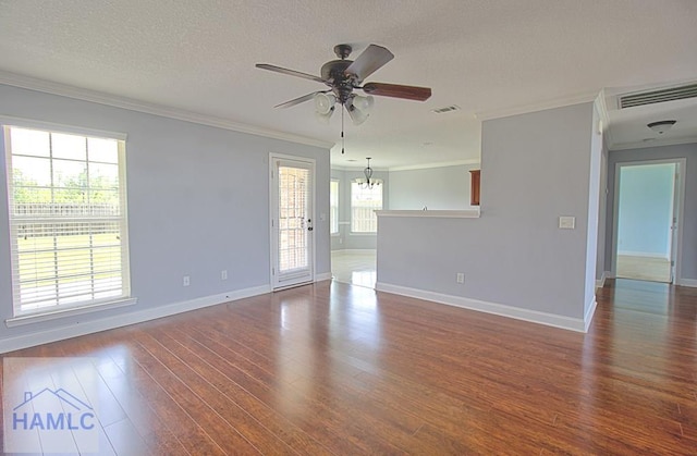 spare room with ceiling fan with notable chandelier, wood-type flooring, a textured ceiling, and ornamental molding