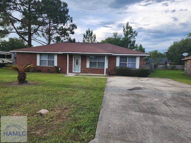 1302 Loblolly Dr, Hinesville, GA 31313 - single story home with a front yard, brick siding, and concrete driveway