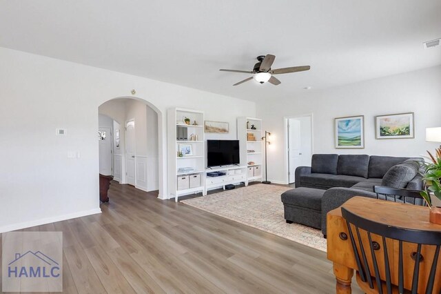 dining space featuring visible vents, a wainscoted wall, wood finished floors, and a notable chandelier
