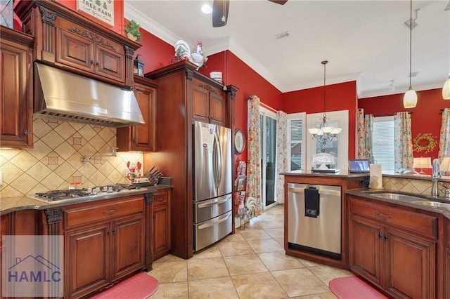 655 Littlefield St, Jesup, GA 31546 - kitchen with a sink, under cabinet range hood, backsplash, dark countertops, and appliances with stainless steel finishes