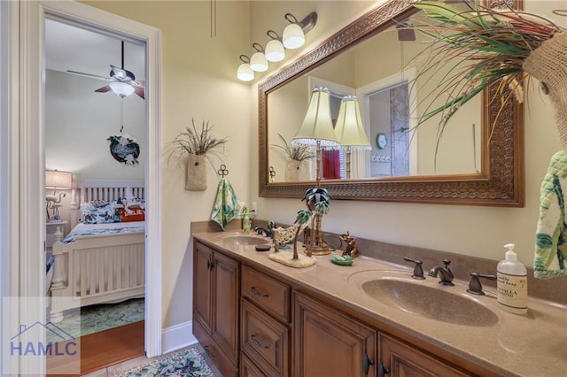 655 Littlefield St, Jesup, GA 31546 - ensuite bathroom with double vanity, connected bathroom, a ceiling fan, and a sink