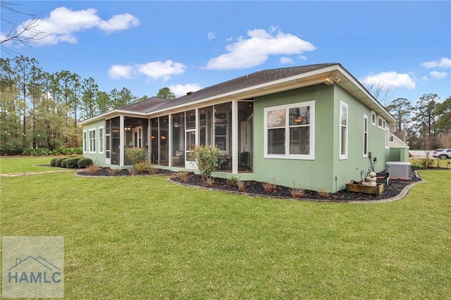 655 Littlefield St, Jesup, GA 31546 - exterior space featuring central AC, a yard, and a sunroom