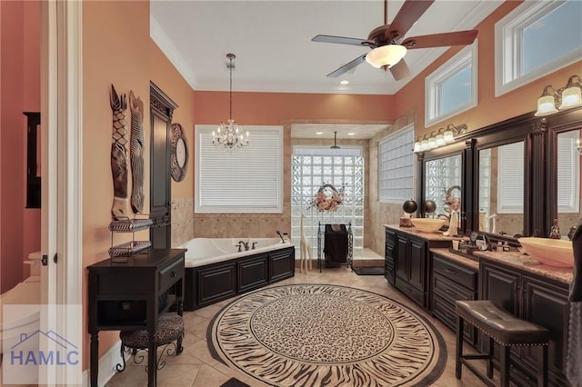 655 Littlefield St, Jesup, GA 31546 - full bathroom featuring tile walls, ornamental molding, ceiling fan with notable chandelier, a garden tub, and vanity