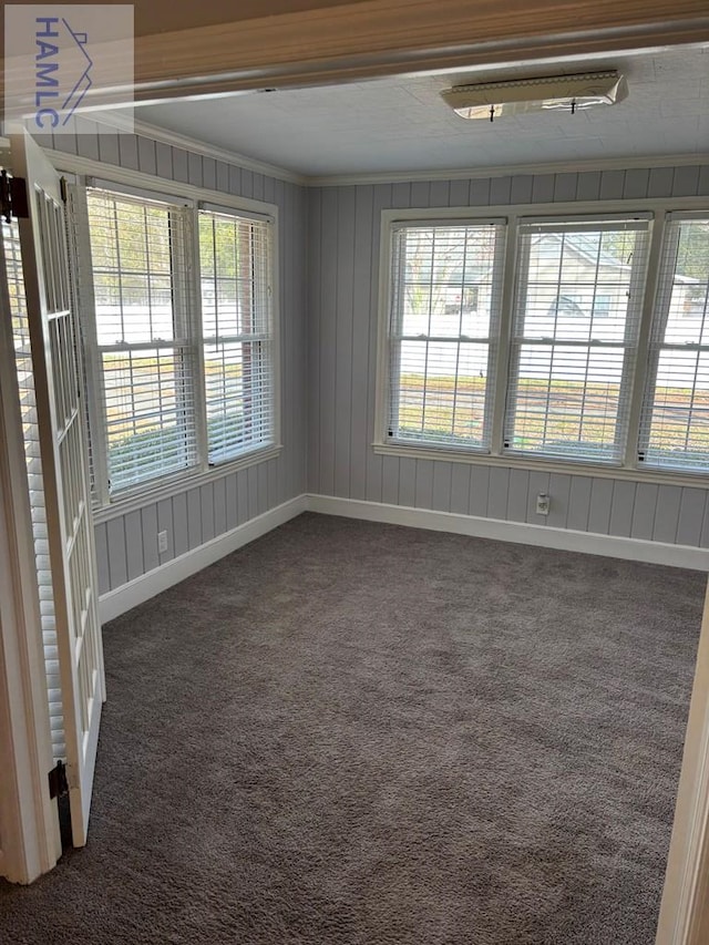 carpeted spare room with ornamental molding