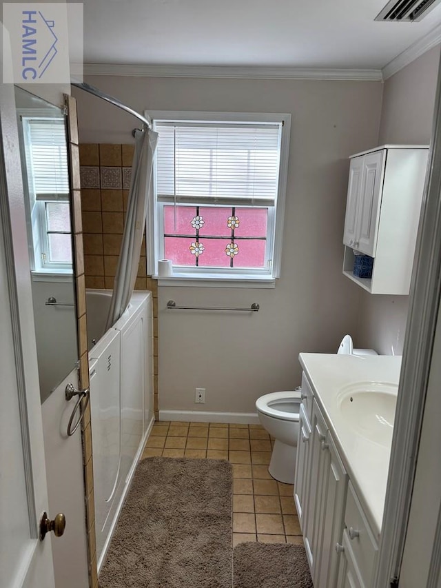 full bathroom with vanity, plenty of natural light, tile patterned floors, and shower / bath combo with shower curtain