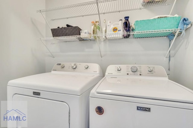 clothes washing area featuring independent washer and dryer