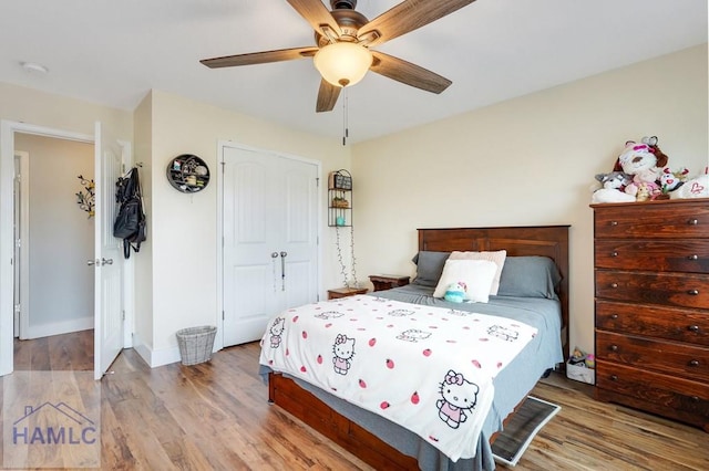 bedroom featuring a closet, ceiling fan, and hardwood / wood-style flooring