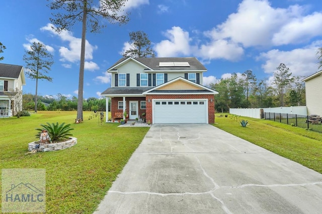 view of front of home with solar panels, a garage, and a front yard