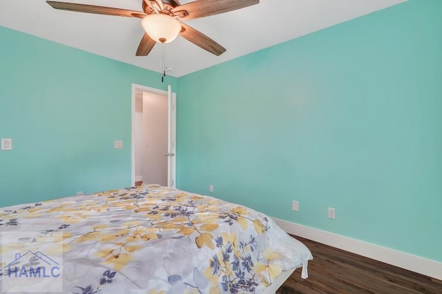 bedroom with ceiling fan and dark wood-type flooring