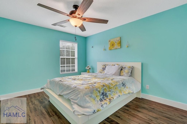 bedroom featuring ceiling fan and dark wood-type flooring