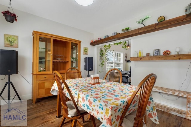 dining area featuring dark hardwood / wood-style floors