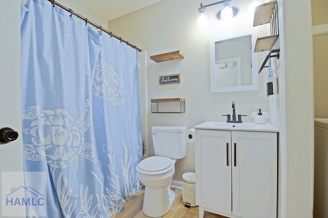776 Madison Dr, Hinesville, GA 31313 - full bath featuring toilet, vanity, wood finished floors, and a shower with curtain