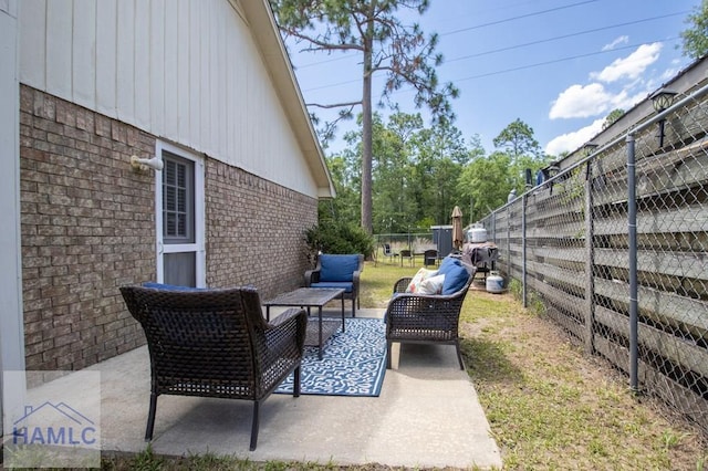 776 Madison Dr, Hinesville, GA 31313 - fenced backyard featuring a patio and an outdoor hangout area