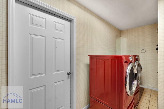 washroom with light tile patterned flooring and independent washer and dryer