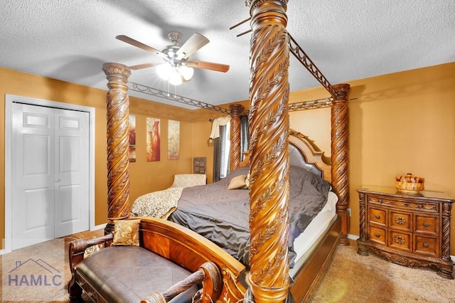 bedroom featuring ceiling fan, a closet, light carpet, and a textured ceiling