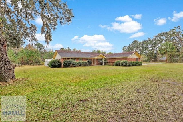 single story home with a front yard