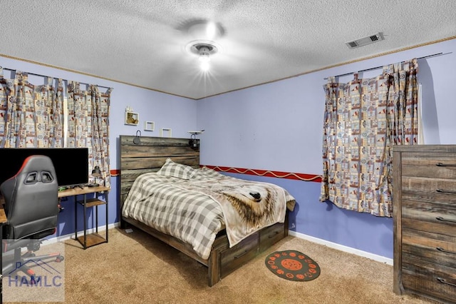 carpeted bedroom featuring a textured ceiling